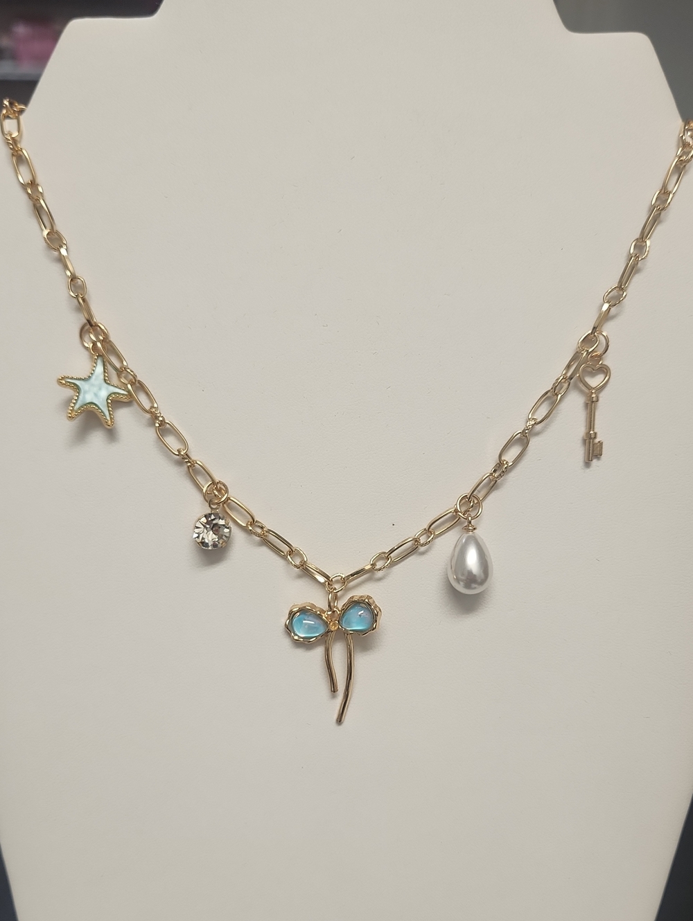Gold Tone Charm Necklace with Aqua Blue Accents - Women Jewelry